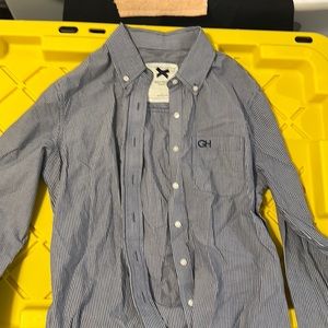 GH . Blue and white striped shirt.